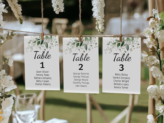 Add a touch of elegance to your outdoor event with these beautiful hanging table cards. Adorned with delicate greenery, these cards guide guests to their seats while enhancing your decor. Perfect for weddings or garden parties, this stylish setup blends nature and sophistication for an unforgettable experience.