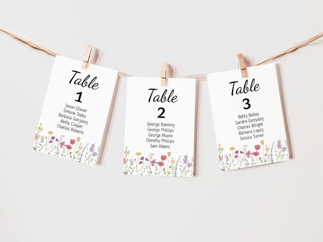 Add a delightful touch to your event with these charming floral table cards. Featuring vibrant wildflower designs, these cards are strung up with natural twine and clothespins, offering a rustic yet elegant way to guide guests to their seats. Perfect for weddings, garden parties, or any nature-inspired event!